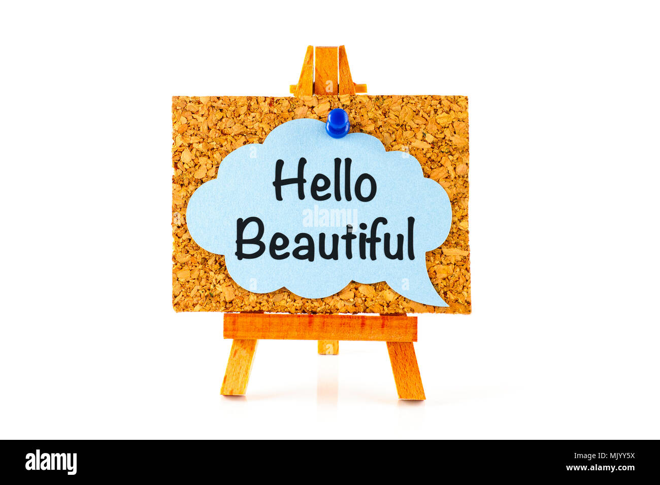 Blue speech bubble with phrase Hello Beautiful on corkboard on wooden easel. White background Stock Photo