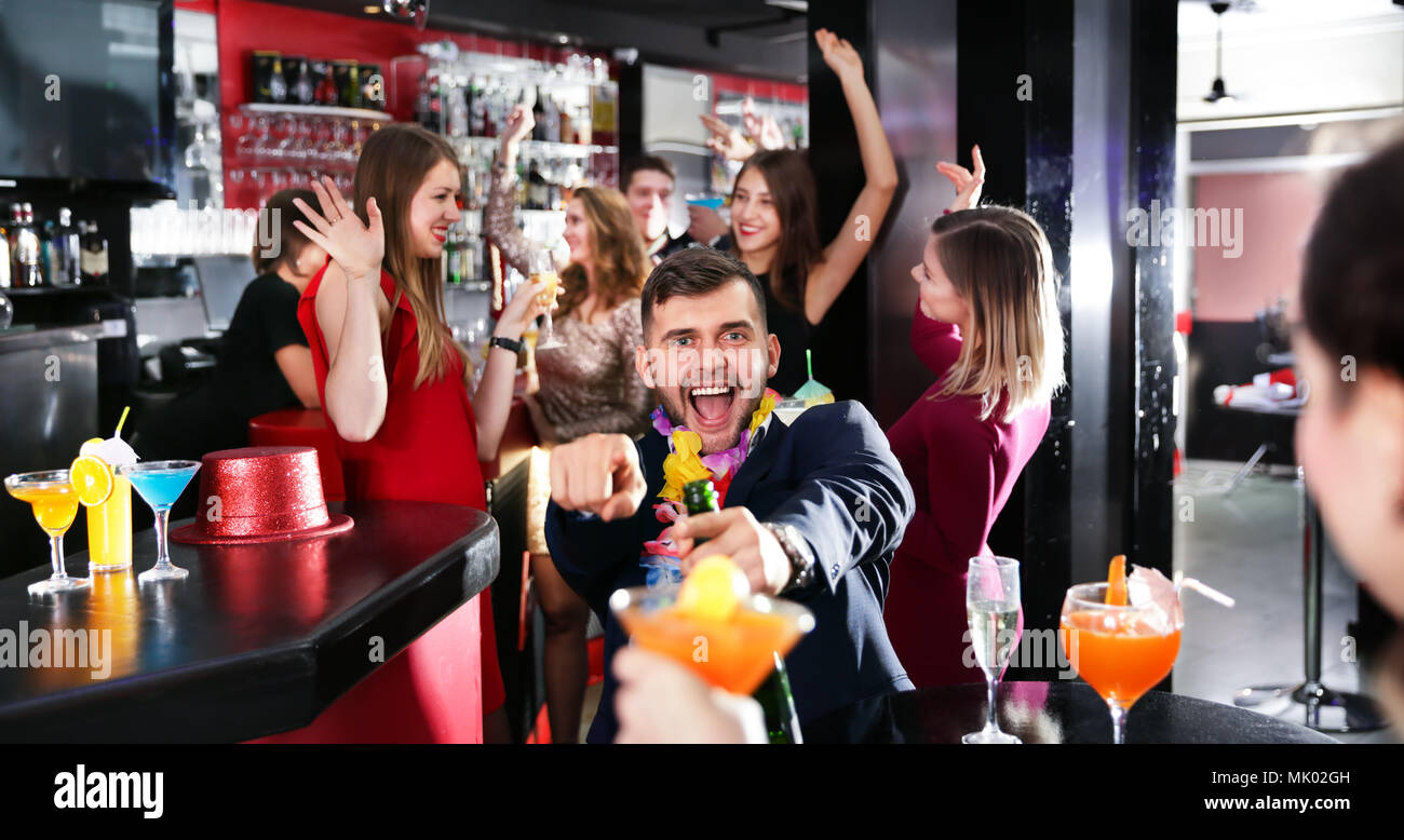 Cheerful guy expressively dancing partying in the bar Stock Photo - Alamy
