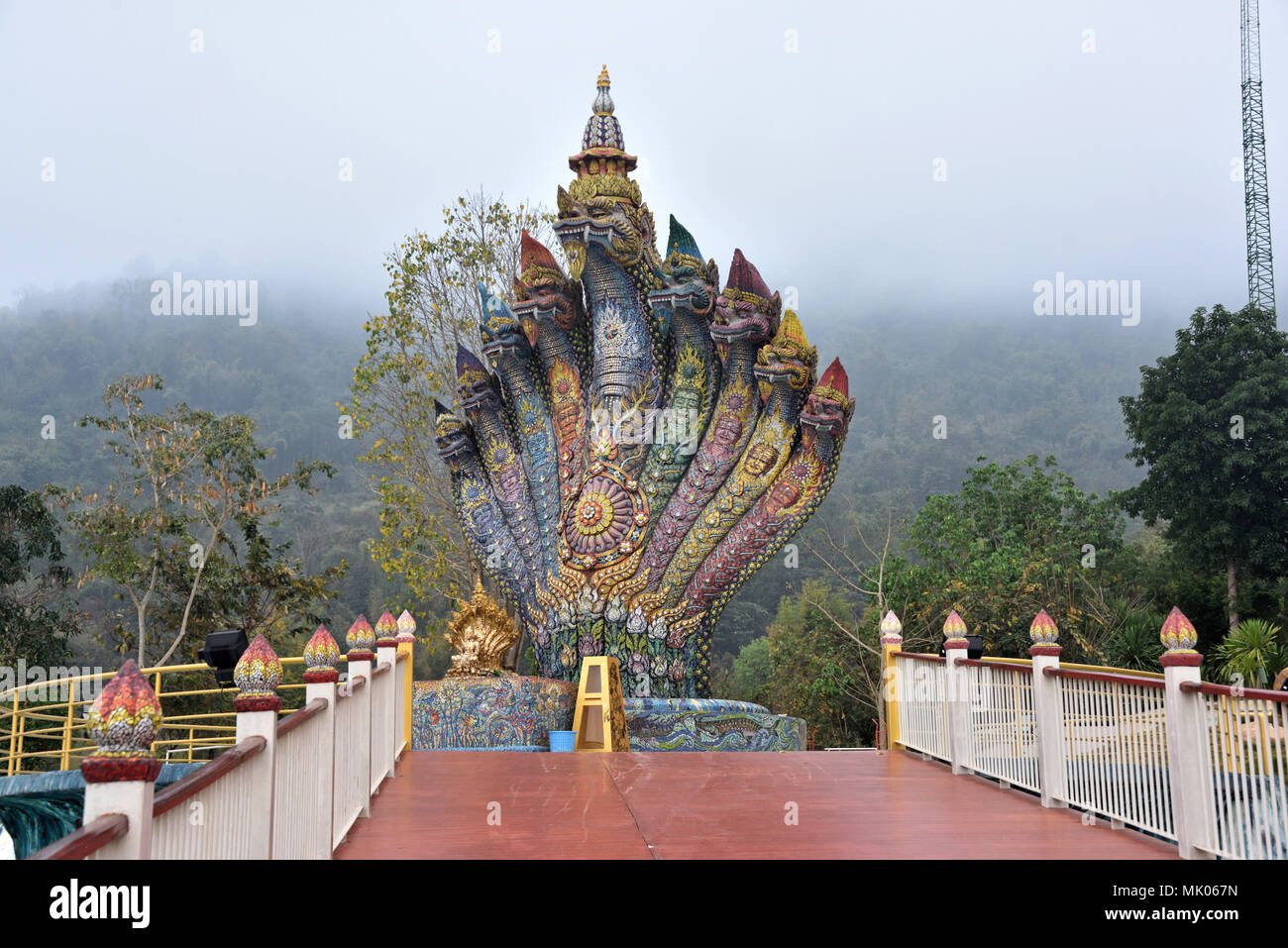 The Nine-headed Naga (serpent) next to Sala Chalermprakiat (hall) at Wat Pa Huai Lat (Temple) in Northern Thailand Stock Photo