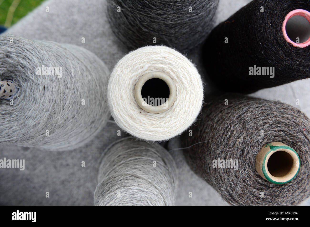 Balls and cones of naturally dyed Shetland wool that are the colours of ...