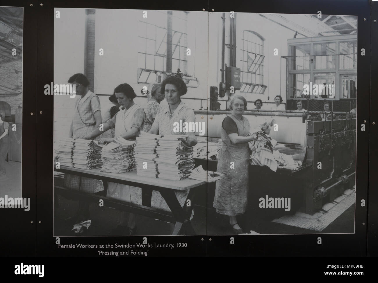 Public display of old historic images about the GWR works, Swindon, Wiltshire, England, UK female workers at works laundry 1930 Stock Photo