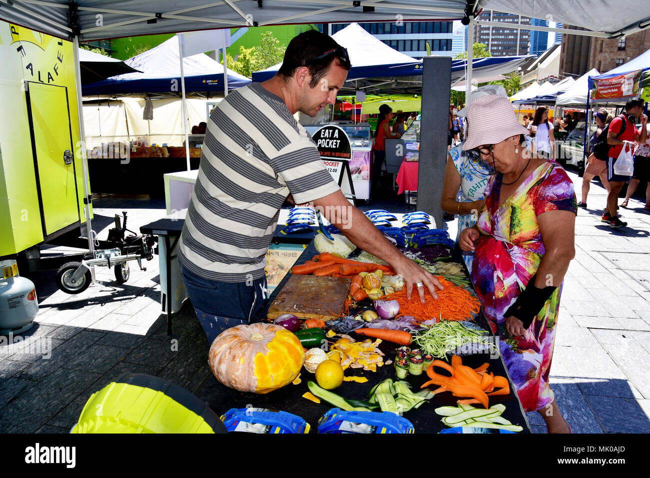 SPROOKER SELLING A KITCHEN UTENSIL AT A MARKET IN BRISBANE Stock Photo