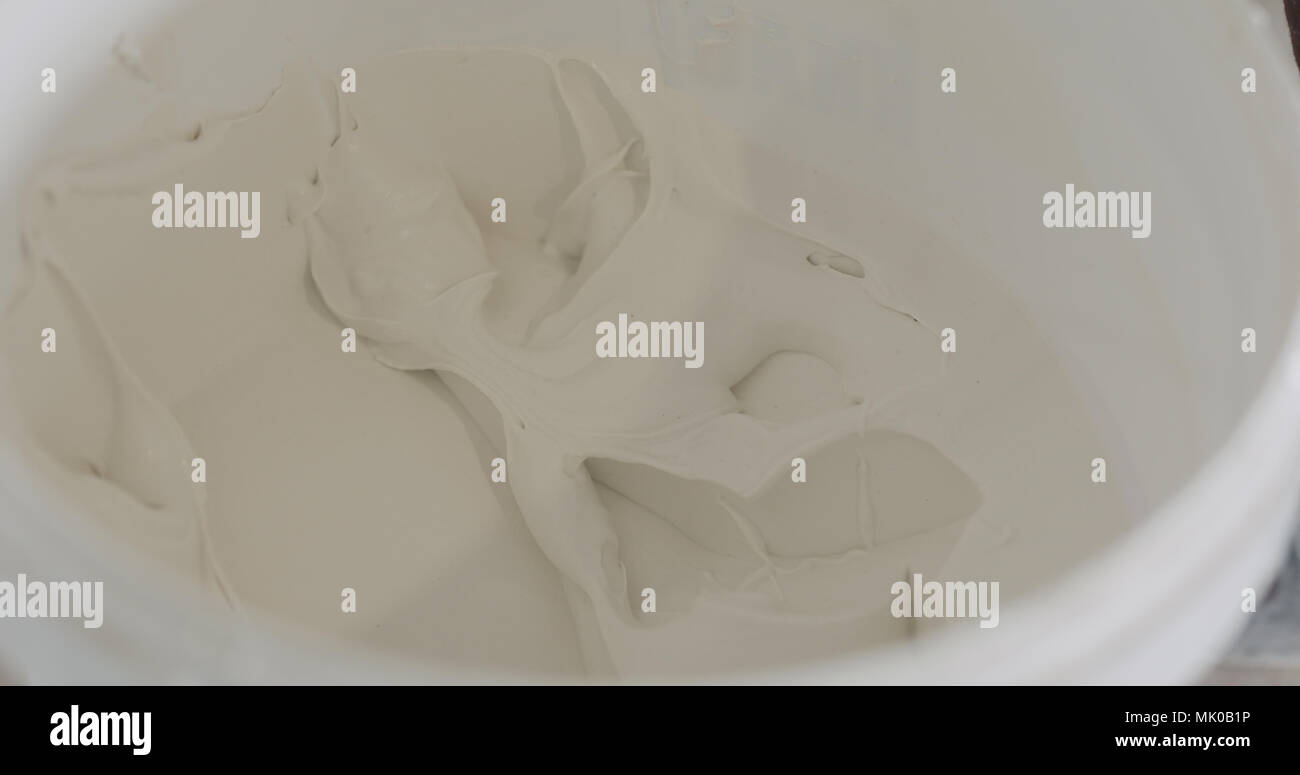white putty ready to apply in a bucket Stock Photo Alamy