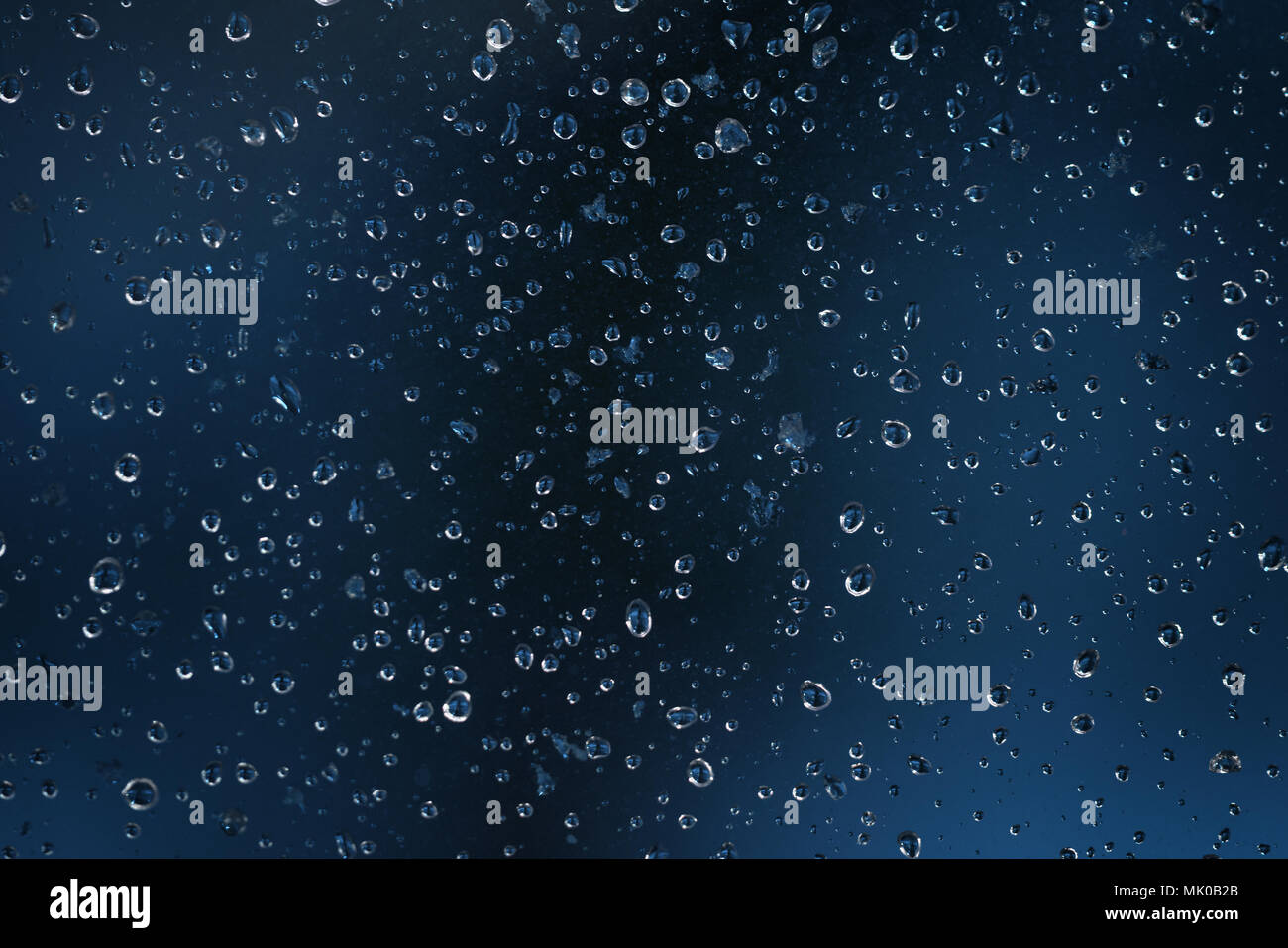 water drops on a dirt glass with shallow focus Stock Photo