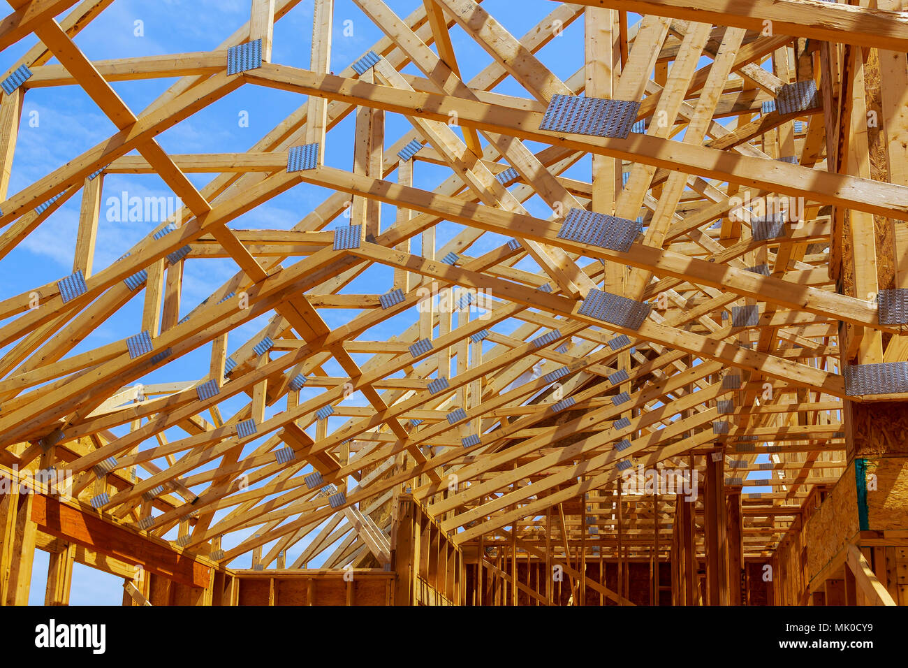 Building site with New home framing Building site with beam, under  construction Stock Photo - Alamy, image size:1300x956