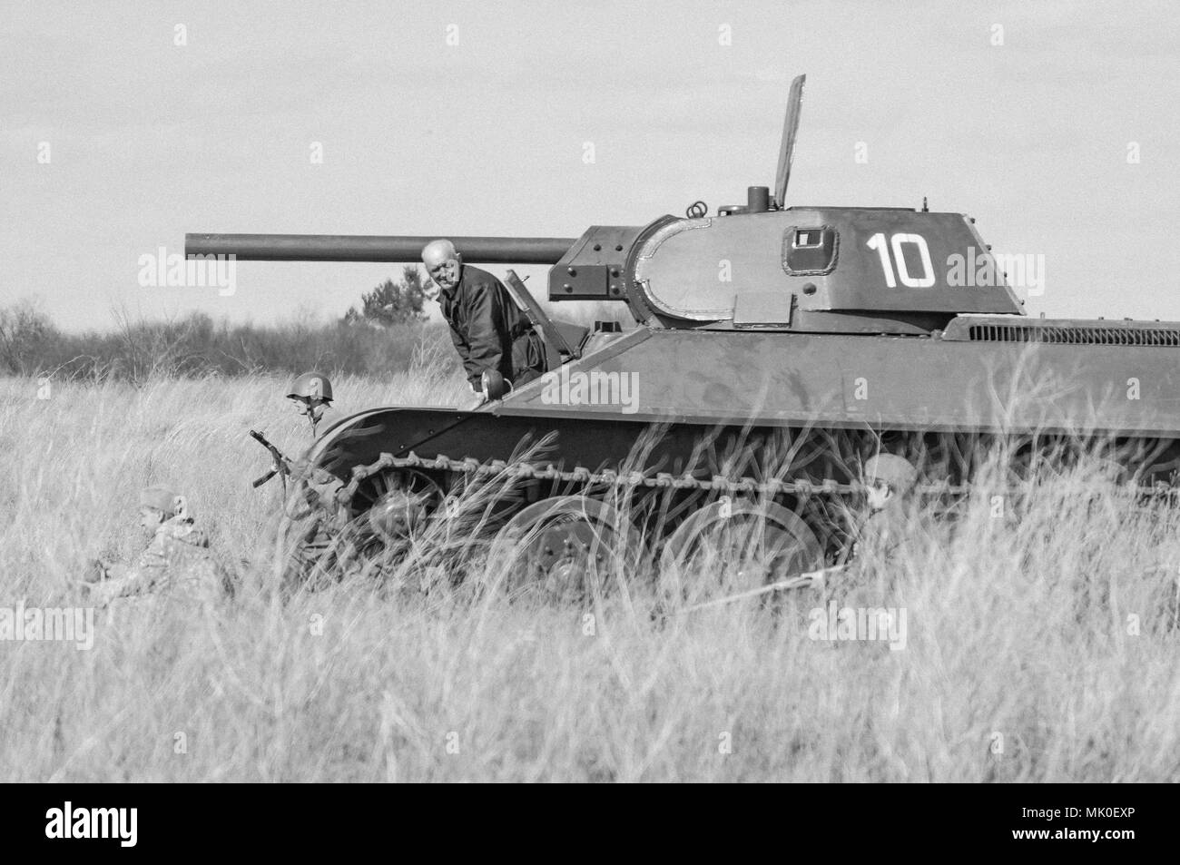 2018-04-30 The Samara Region, Russia. Soviet tank T-34 in the offensive against German troops. Reconstruction of hostilities in April 1945. Stock Photo
