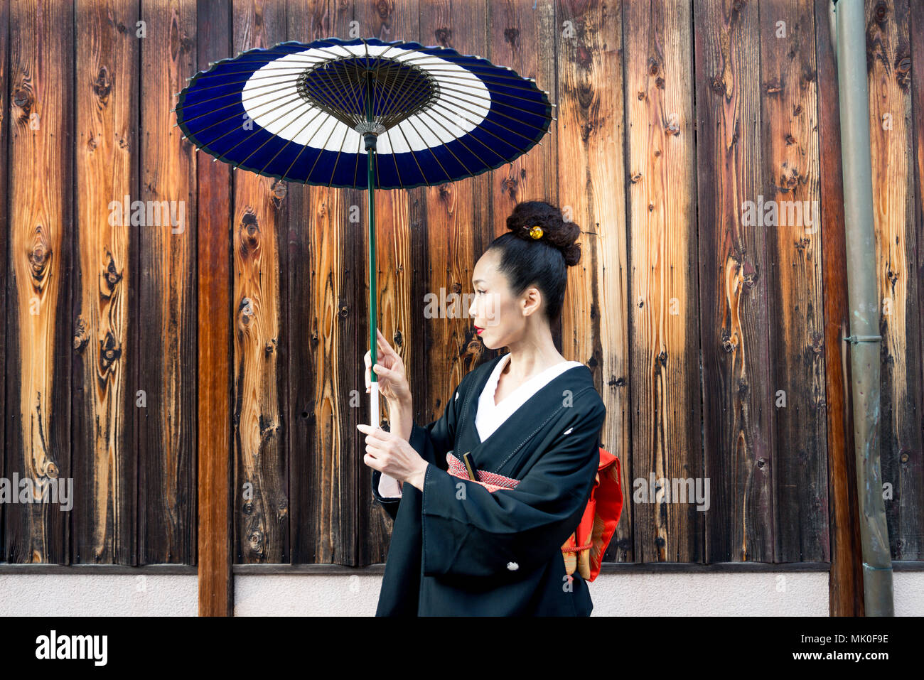 Japanese woman wearing traditional dress and walking outdoors Stock Photo Alamy