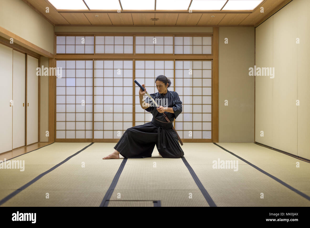 Japanese martial arts athlete training kendo in a dojo Samaurai