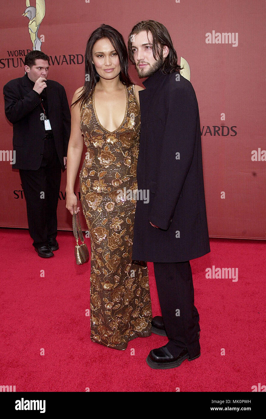 Tia Carrere and Stephen arriving at the 1st World Stunt Awards at the Barker Hangar in Santa Monica Airport in Los Angeles  5/20/2001            -            CarrereTia Stephen01.JPG           -              CarrereTia Stephen01.JPGCarrereTia Stephen01  Event in Hollywood Life - California,  Red Carpet Event, Vertical, USA, Film Industry, Celebrities,  Photography, Bestof, Arts Culture and Entertainment, Topix Celebrities fashion /  from the Red Carpet-, Vertical, Best of, Hollywood Life, Event in Hollywood Life - California,  Red Carpet , USA, Film Industry, Celebrities,  movie celebrities, T Stock Photo