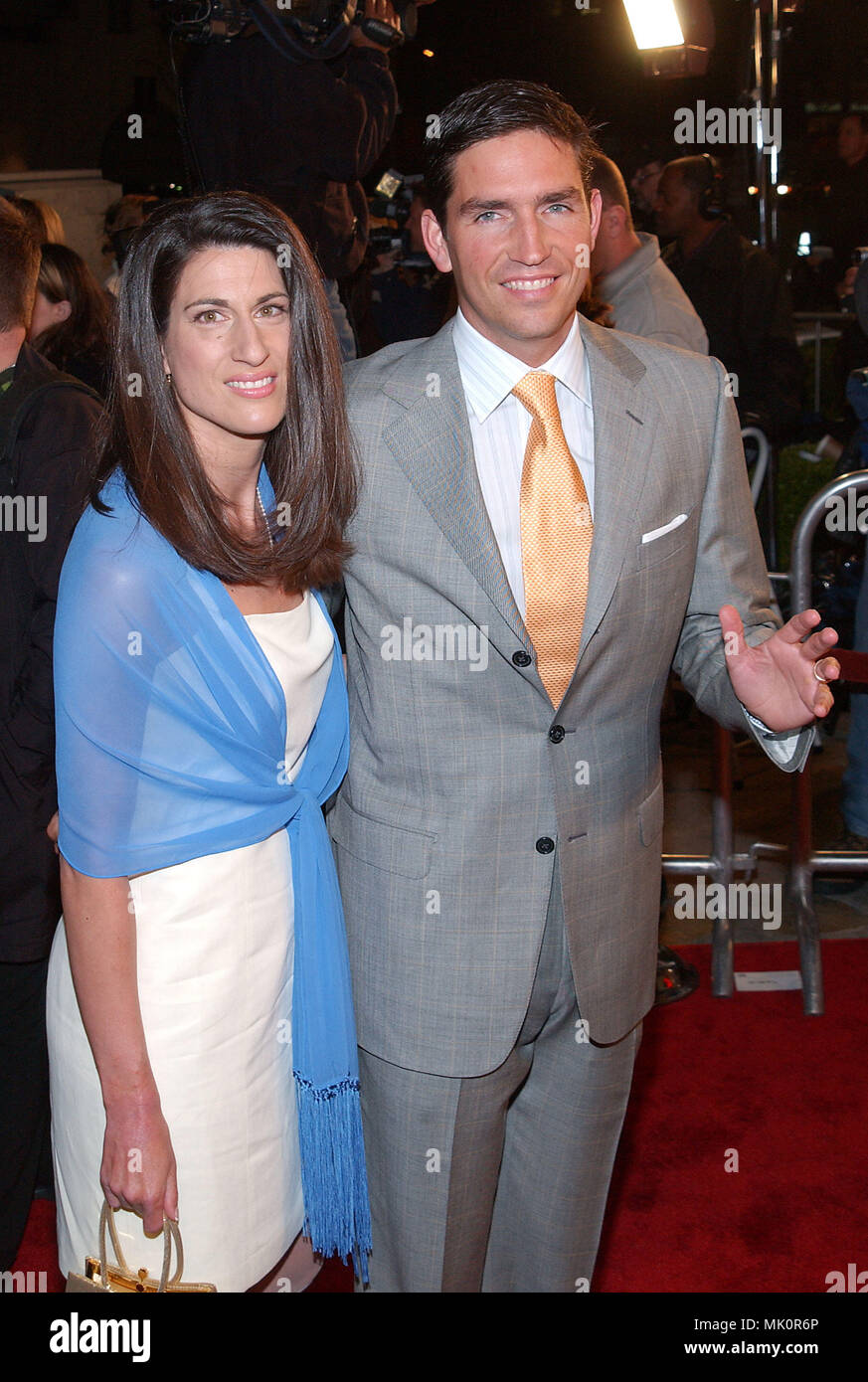 Jim Cazaviel and wife posing at the premiere of High Crimes at the Mann ...