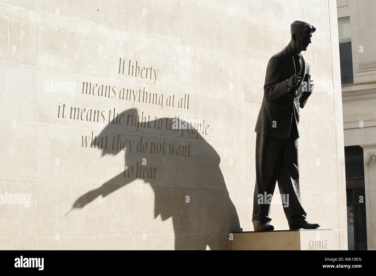 Orwell statue casting a shadow in the bright sun outside BBC