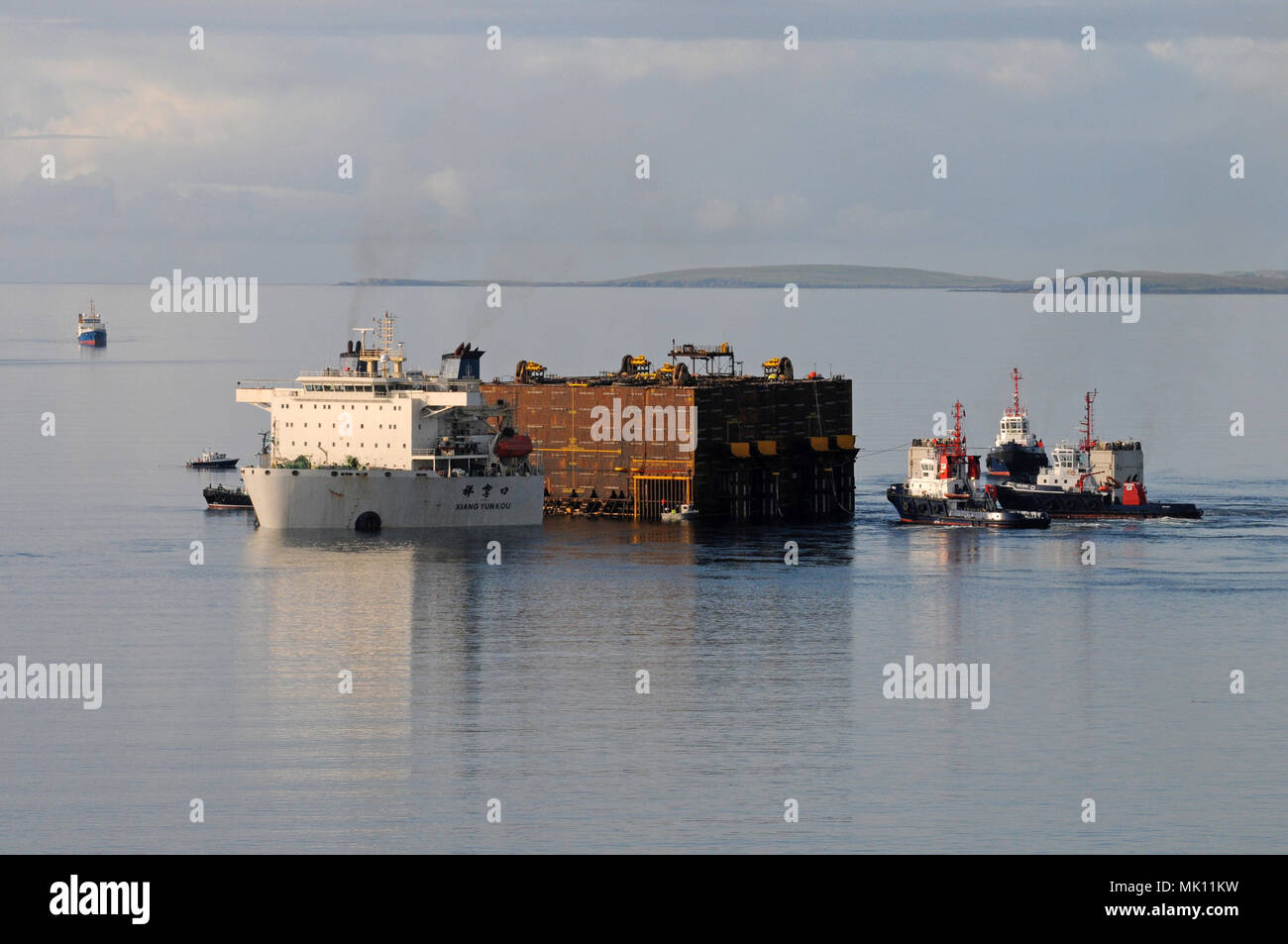 Heavy lifting vessel Xiang Yun Kou delivering a part of the Clair ridge project to the north sea and having it unloaded by submerging herself. Stock Photo