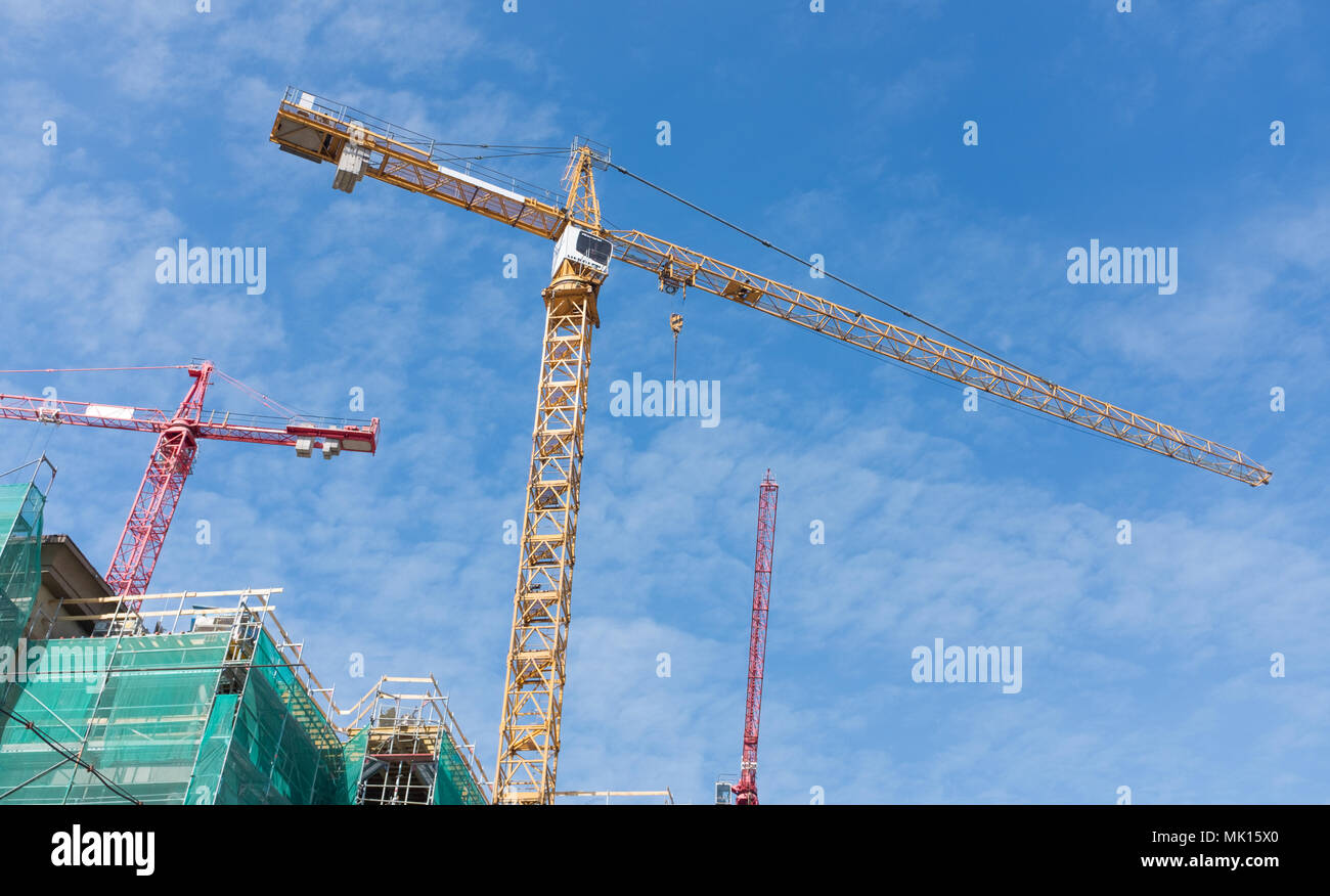 high cranes on the construction site Stock Photo Alamy