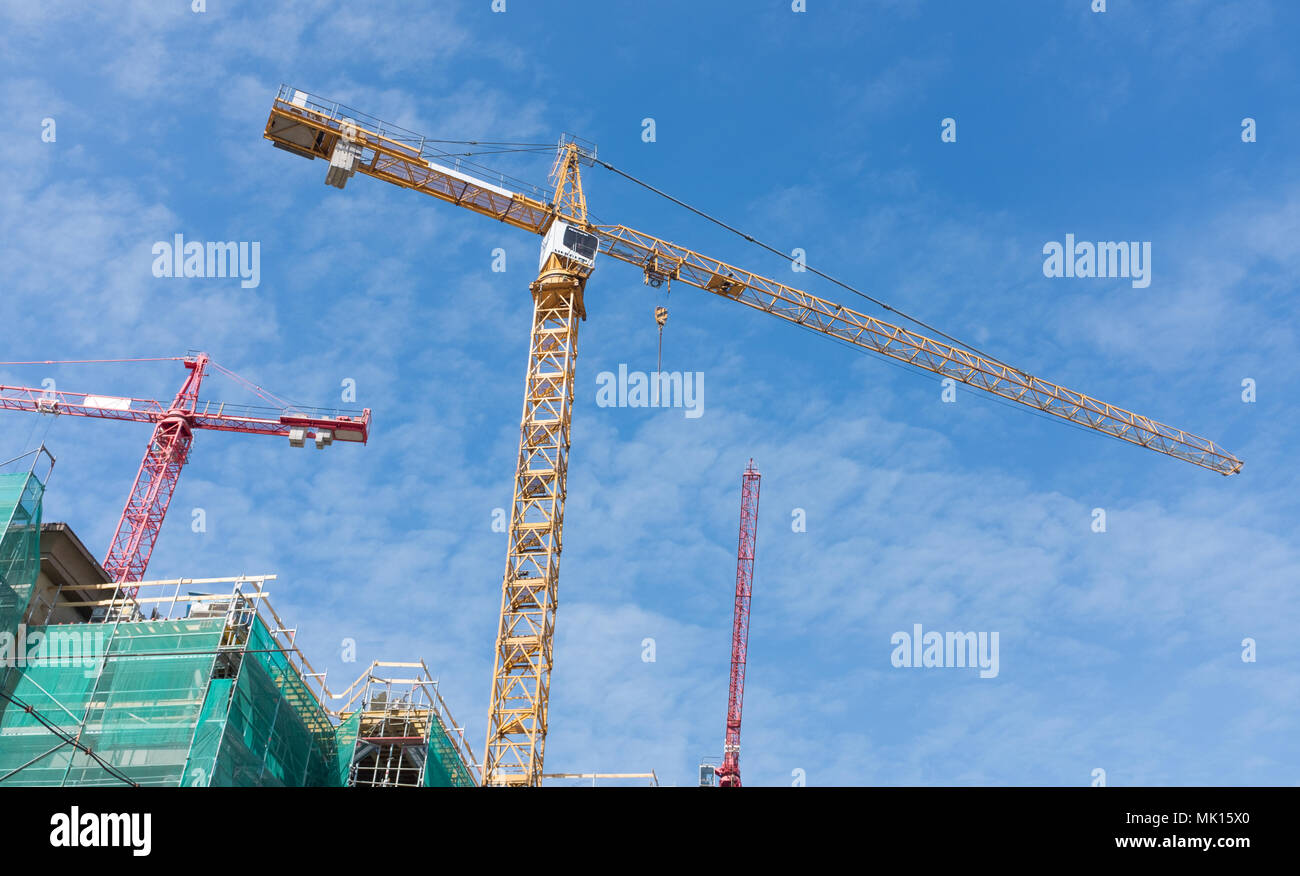high cranes on the construction site Stock Photo