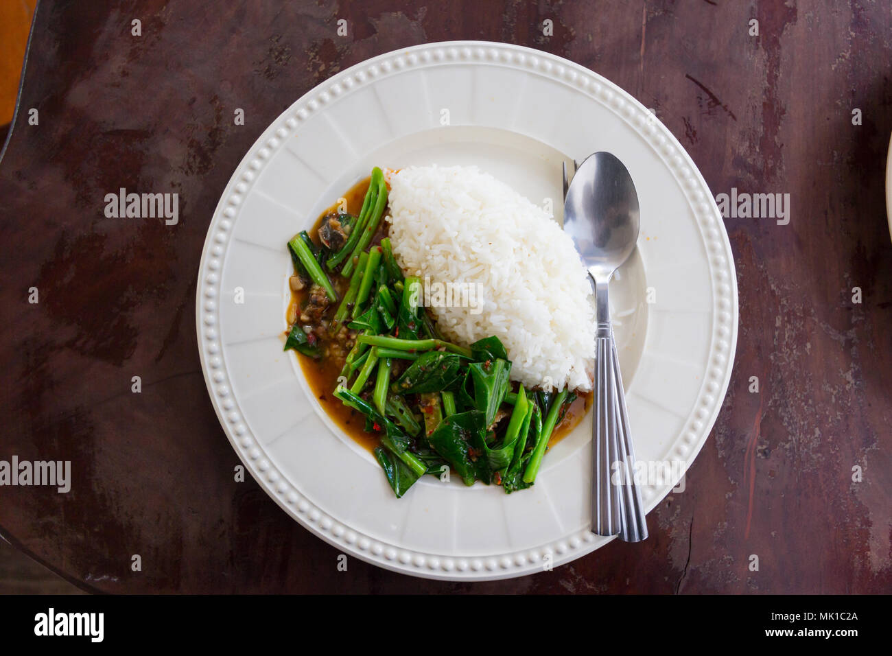 rice with salted fish kale in white disk in Thai resturant Stock Photo ...