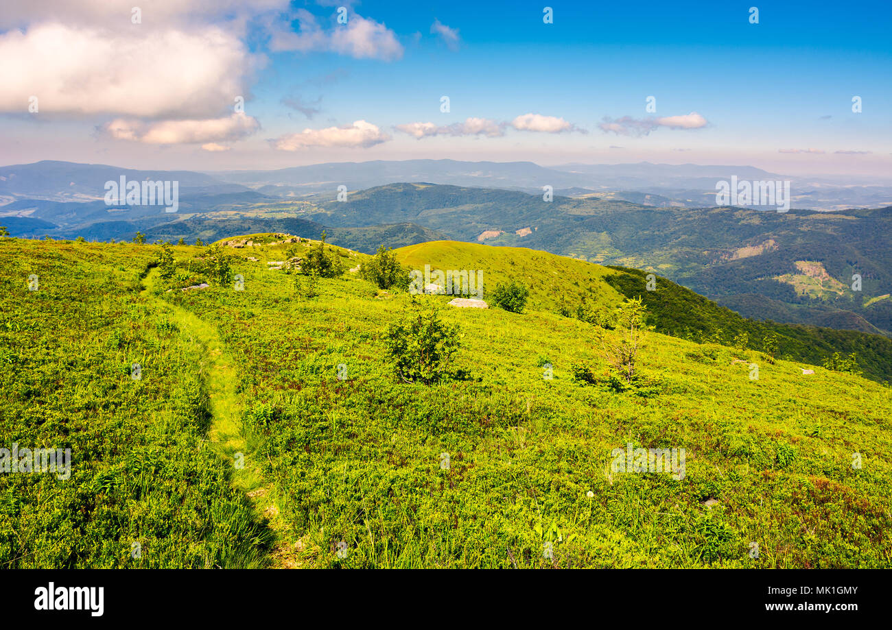 tourist footpath through mountain ridge. beautiful summer landscape under the gorgeous blue sky with some clouds Stock Photo