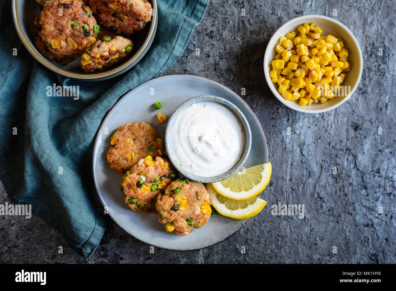 Healthy tuna Fish cakes with green peas, corn and scallion served with