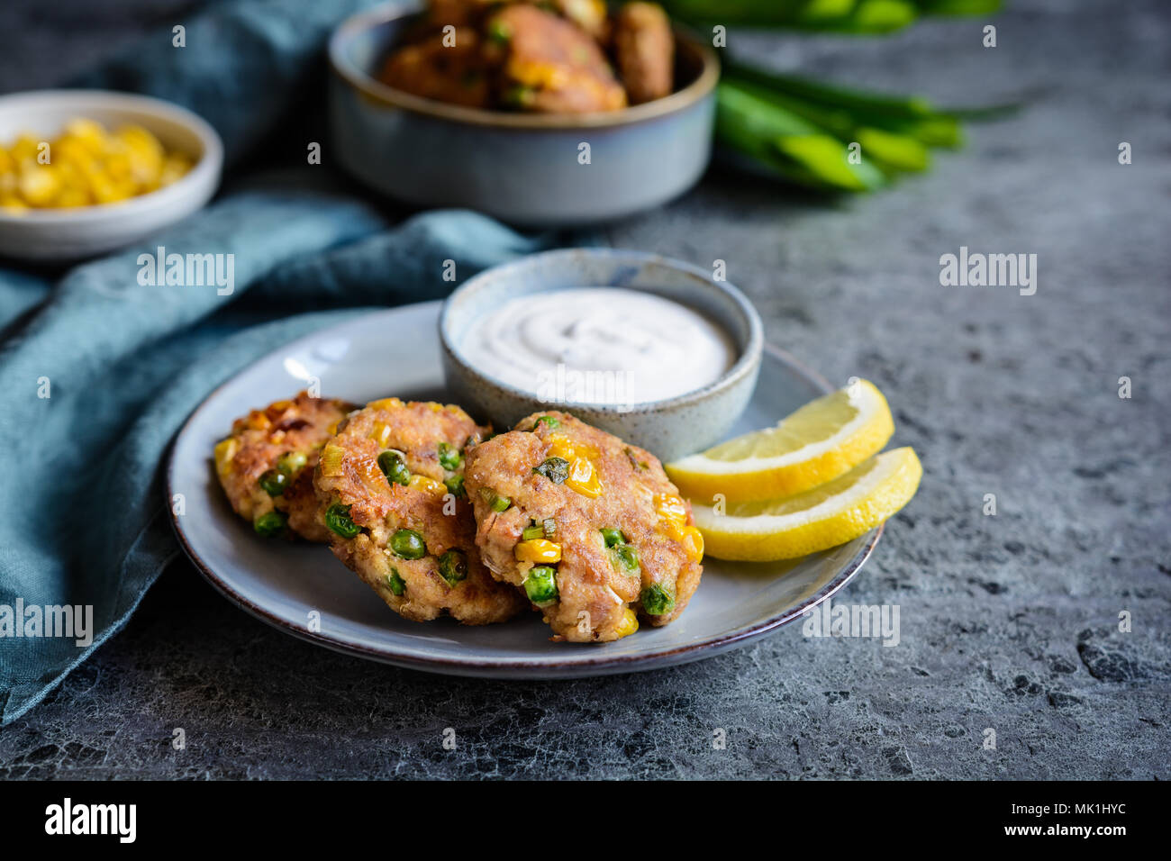 Healthy tuna Fish cakes with green peas, corn and scallion served with