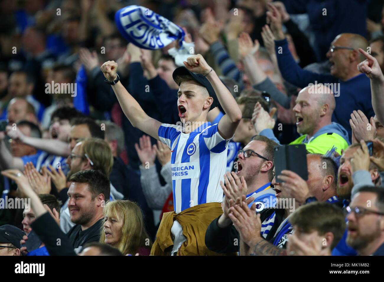 Brighton fans celebrate victory after  the Premier League match between Brighton and Hove Albion and Manchester United at the American Express Community Stadium in Brighton and Hove. 04 May 2018 *** EDITORIAL USE ONLY ***  No merchandising. For Football images FA and Premier League restrictions apply inc. no internet/mobile usage without FAPL license - for details contact Football Dataco Stock Photo