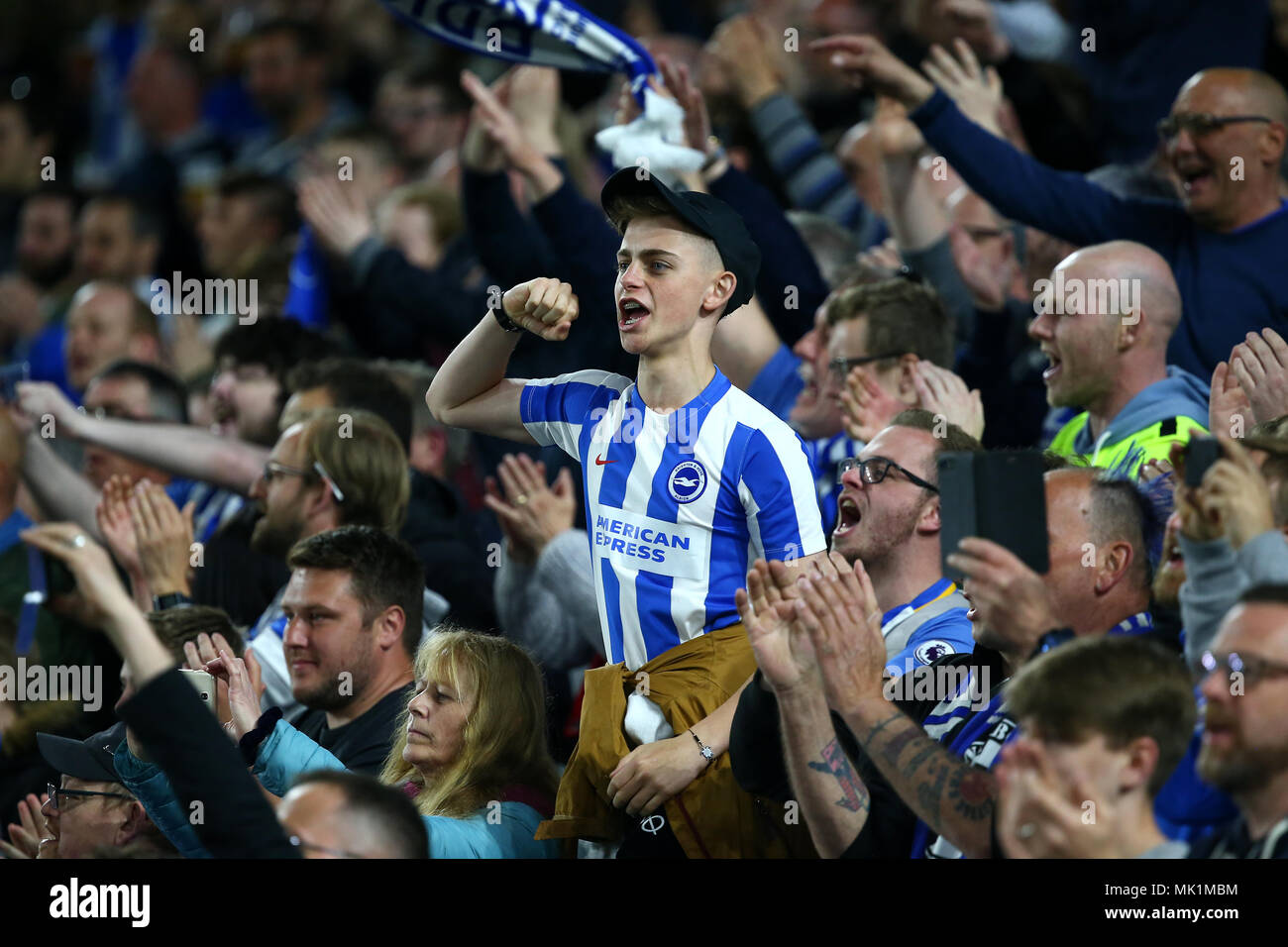 Brighton fans celebrate victory after  the Premier League match between Brighton and Hove Albion and Manchester United at the American Express Community Stadium in Brighton and Hove. 04 May 2018 *** EDITORIAL USE ONLY ***  No merchandising. For Football images FA and Premier League restrictions apply inc. no internet/mobile usage without FAPL license - for details contact Football Dataco Stock Photo