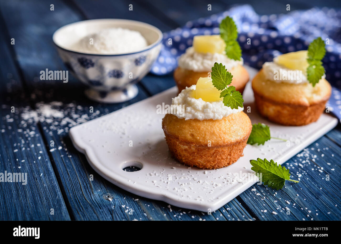 Coconut and pineapple muffins with yoghurt topping Stock Photo Alamy