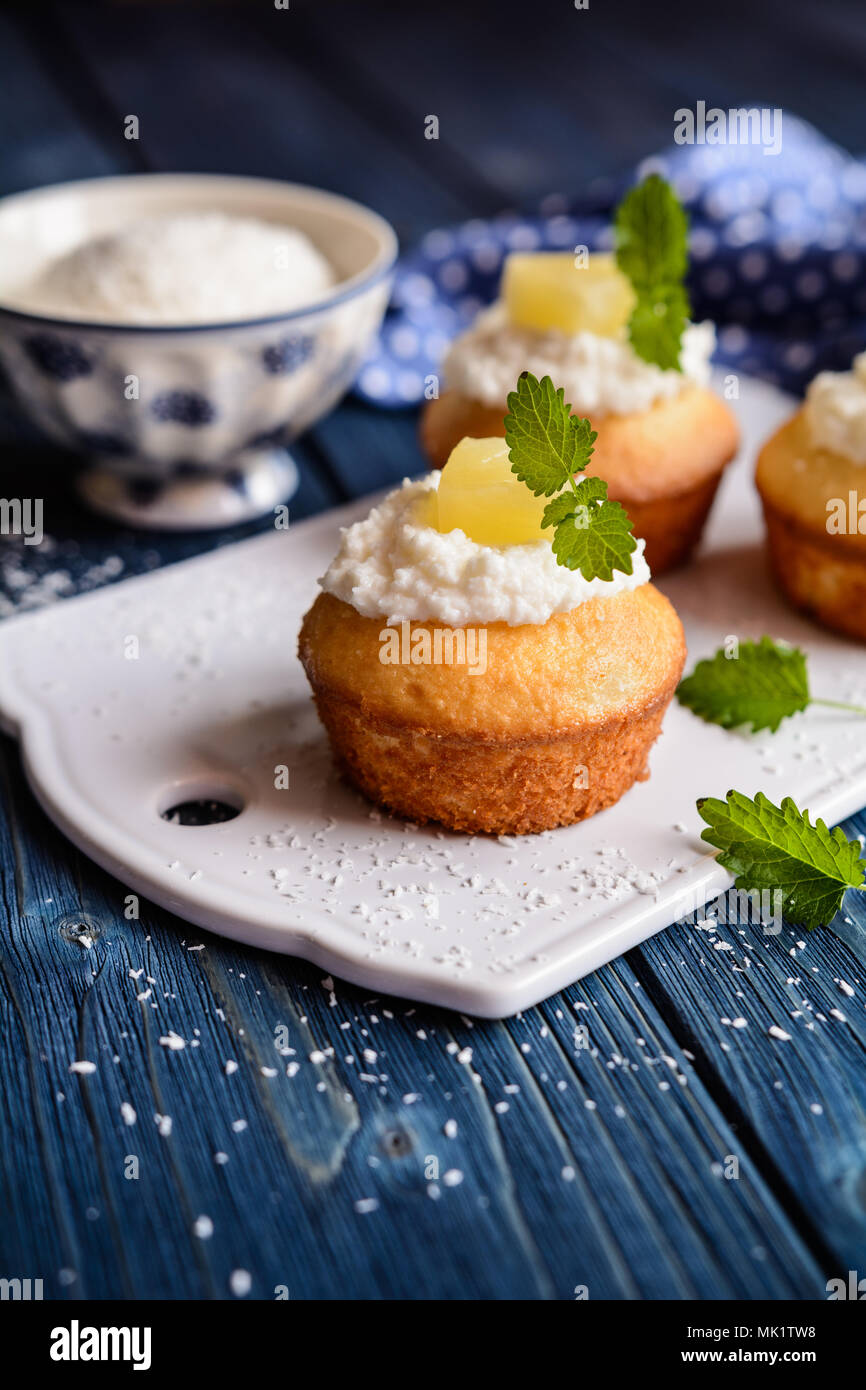 Coconut and pineapple muffins with yoghurt topping Stock Photo Alamy