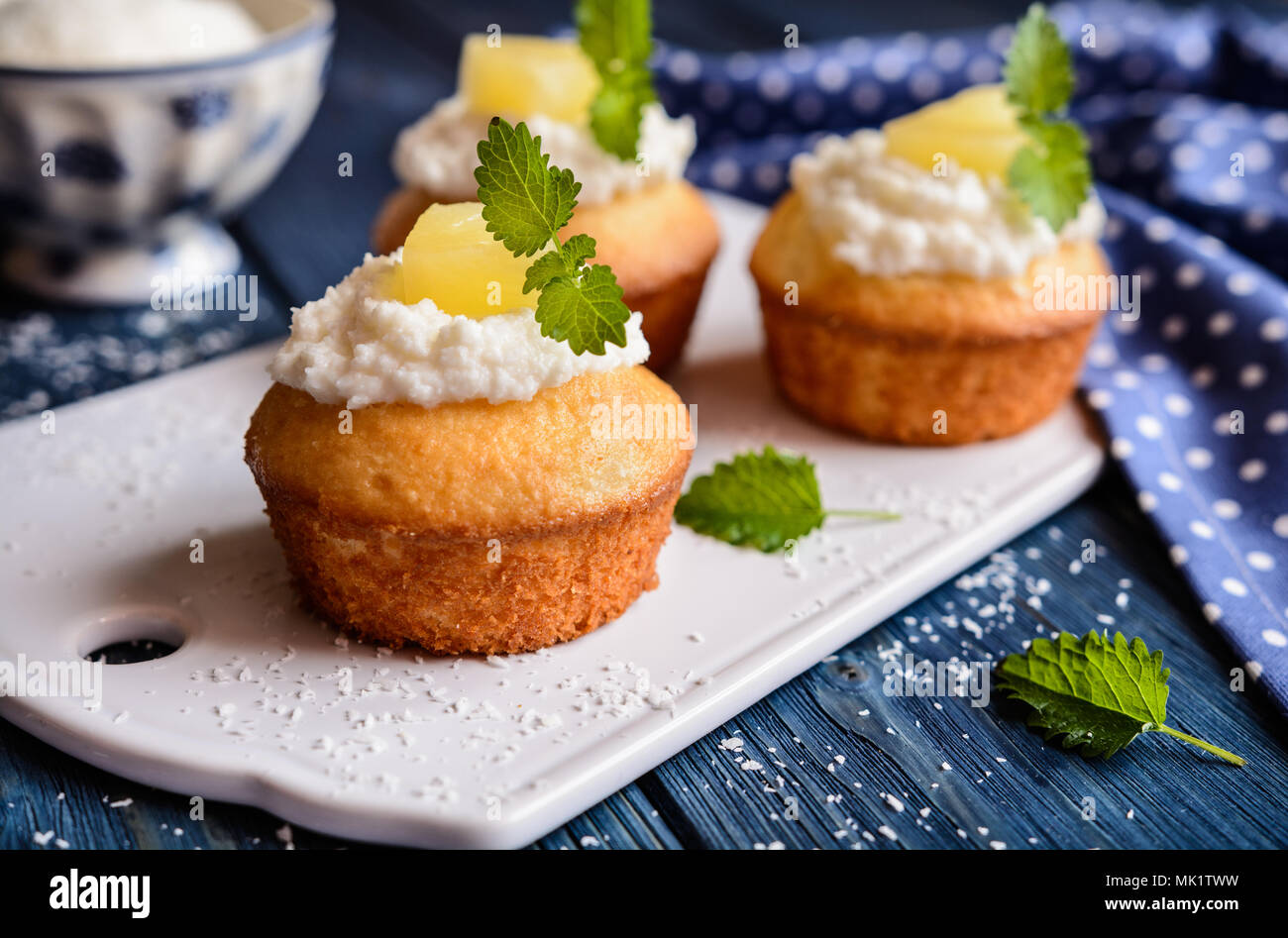 Coconut and pineapple muffins with yoghurt topping Stock Photo Alamy