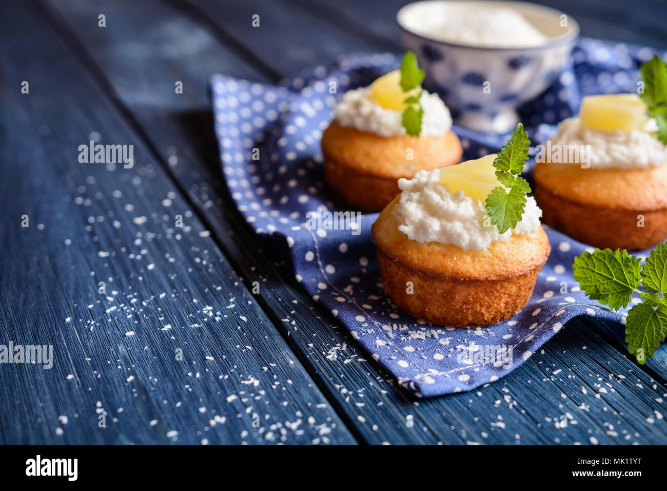 Coconut and pineapple muffins with yoghurt topping Stock Photo Alamy