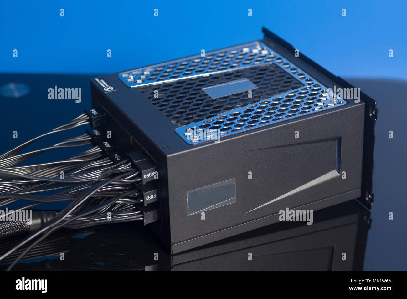 Computer Power Supply Unit on blue background Stock Photo - Alamy