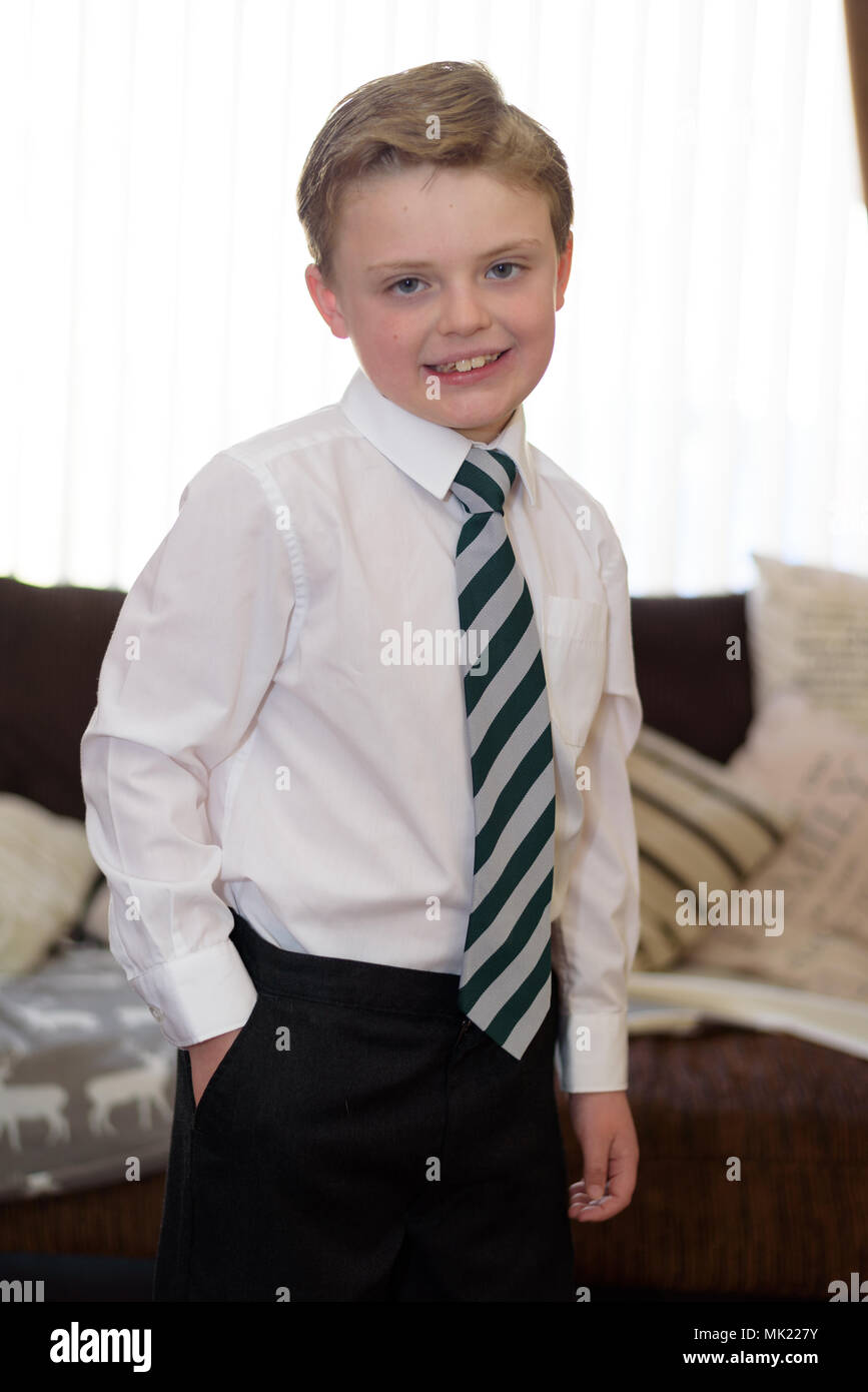 Young boy dressed in new uniform and ready for school Stock Photo Alamy