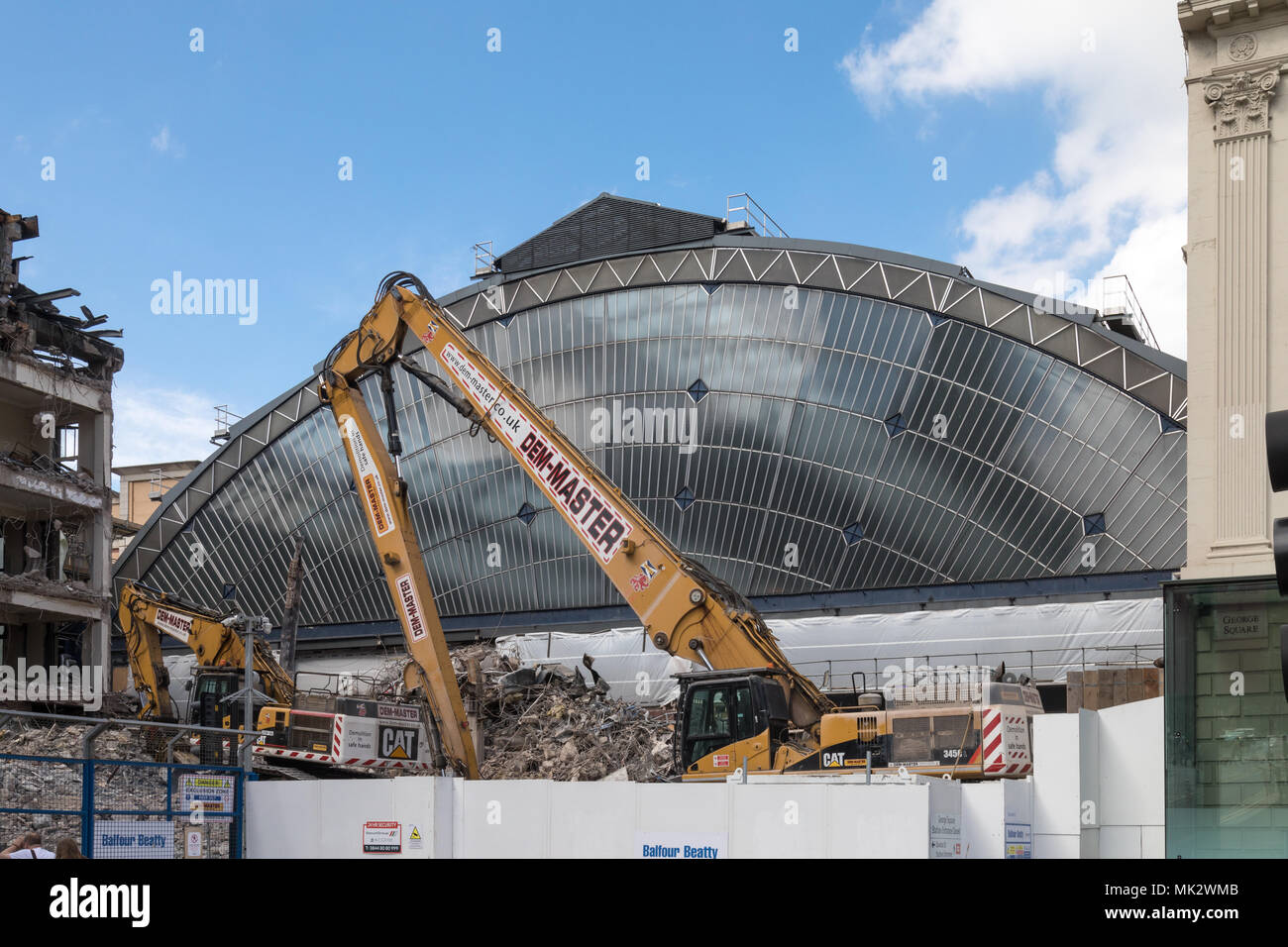 The previously hidden glass front of Glasgow Queen Street Station is visible again as the building in front is demolished Stock Photo