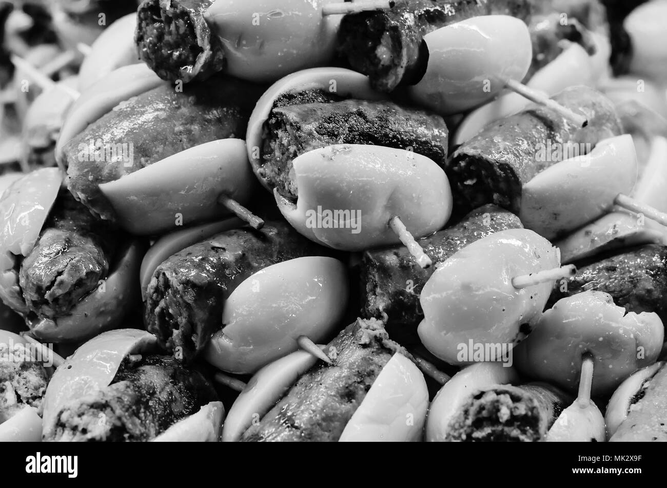 Typical Spanish olive tapas in a bar, consisting of an appetizer that is served with a drink
