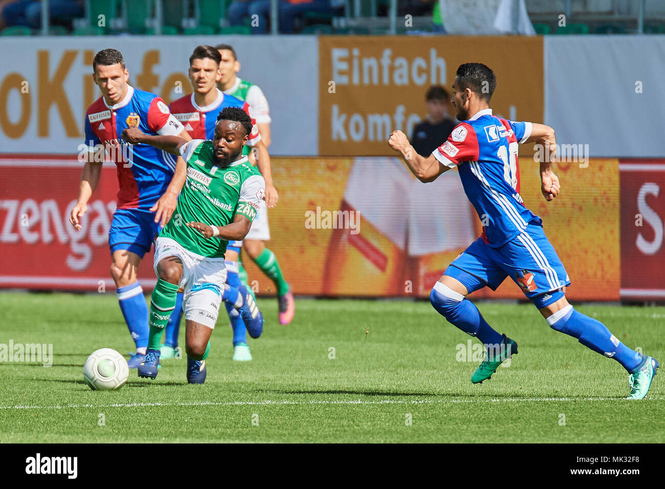St. Gallen, Switzerland. 6th May 2018. Dejan Stojanovic saves before  Mohamed Elyounoussi during the Raiffeisen Super