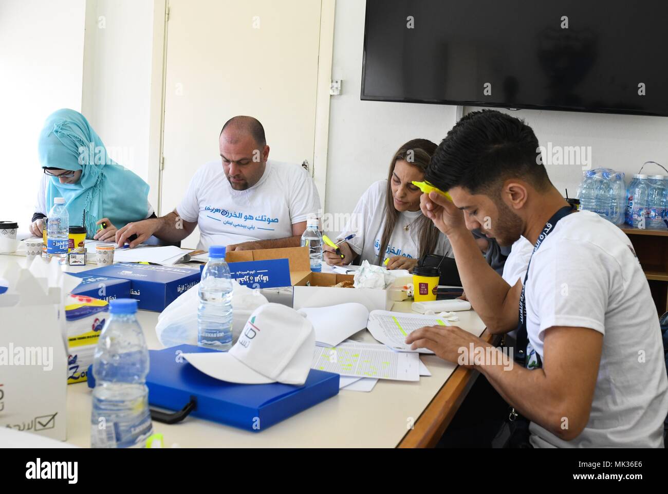 Saida, Lebanon. 6th May, 2018. Staff members work at a polling station in Saida, Lebanon, on May 6, 2018. Some 3.7 million Lebanese people are registered to cast their votes in the parliamentary elections on Sunday, the first of their kind since the adoption of a new law that allows proportional representation. Credit: Wu Huiwo/Xinhua/Alamy Live News Stock Photo