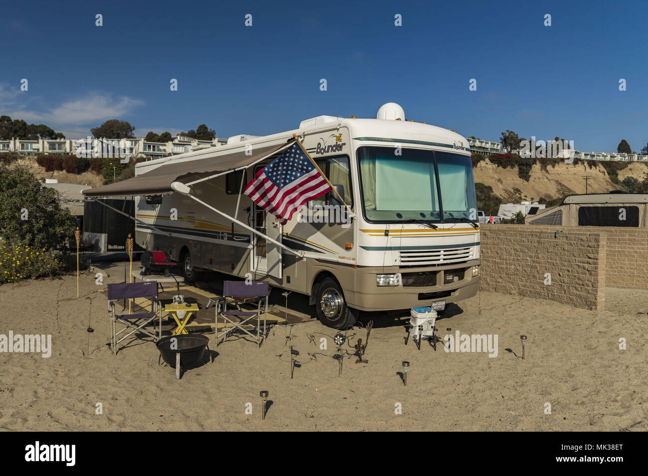 Irvine, California, USA. 30th Sep, 2017. The term recreational vehicle (RV) is often used as a broad category of motor vehicles and trailers which include living quarters for designed temporary accommodation. Typical amenities of an RV include a kitchen, a bathroom, and one or more sleeping facilities. RVs can range from the utilitarian containing only sleeping quarters and basic cooking facilities to the luxurious, with features like air conditioning (AC), water heaters, televisions and satellite receptors, and quartz countertops, for example.RVs can either be trailers (which are Stock Photo