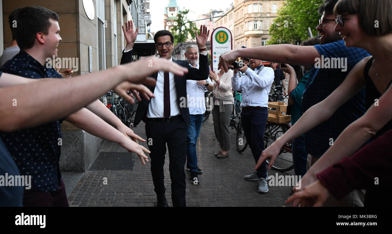 06 May 2018, Germany, Freiburg: The newly elected mayor of Freiburg Martin Horn (independent; supported by the Social Democratic Party (SPD)) stands in front of his celebrating supporters. Later, he was attacked and hurt at the election party. Photo: Patrick Seeger/dpa Stock Photo