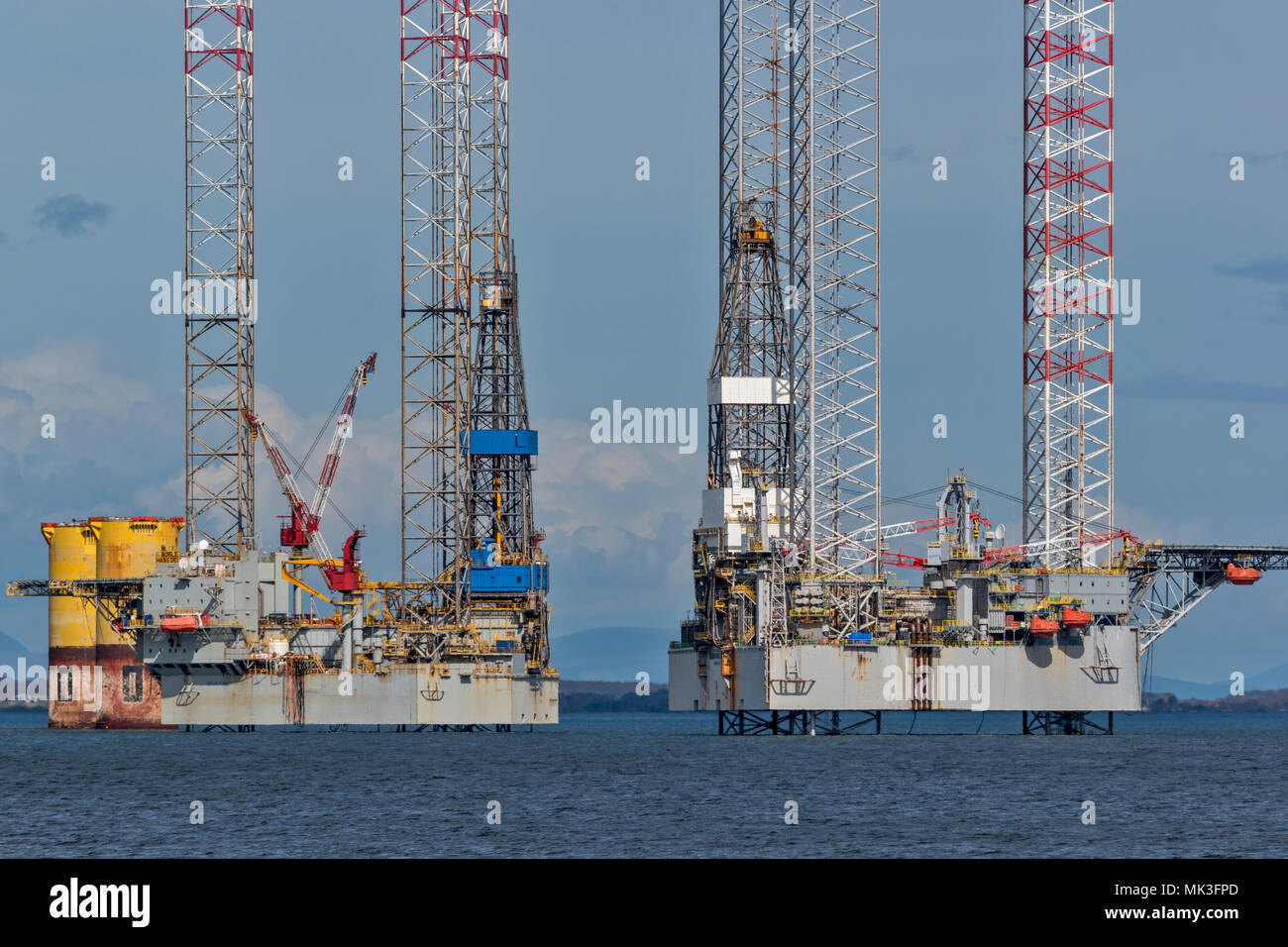 CROMARTY FIRTH SCOTLAND  OIL PLATFORMS OR DECOMMISSIONED OIL RIGS LYING OFF CROMARTY VILLAGE Stock Photo