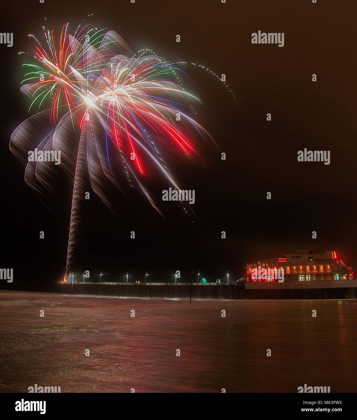 Fireworks being shot from the pier at Daytona Beach in Florida Stock