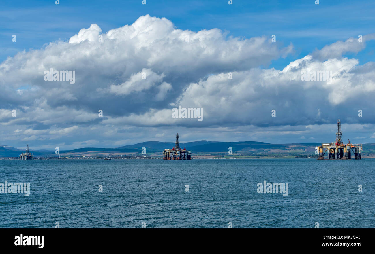 CROMARTY FIRTH SCOTLAND THREE DECOMMISSIONED OIL RIGS UNDERGOING REPAIR LYING OFF CROMARTY Stock Photo