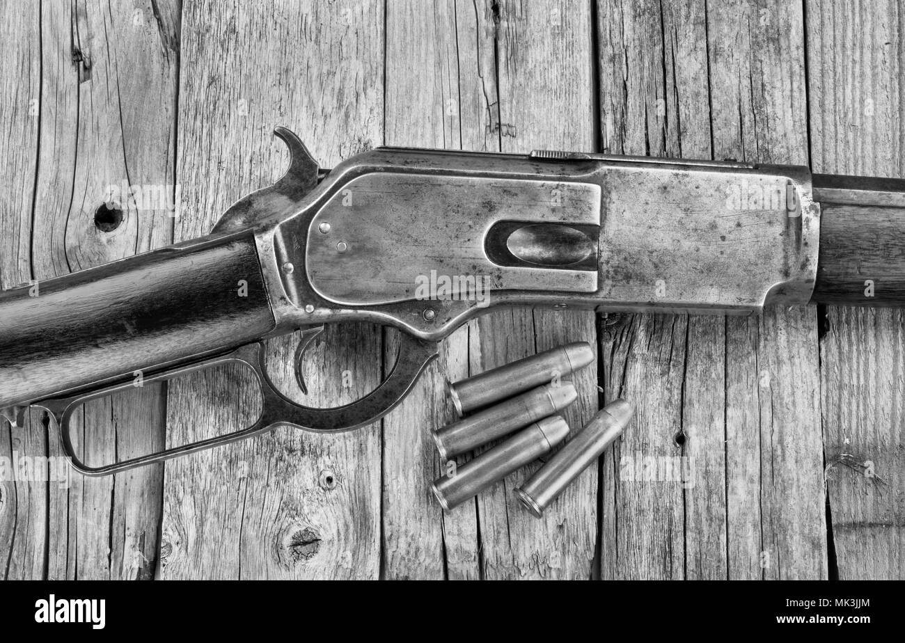 Antique 1876 lever action cowboy rifle in black and white. Stock Photo