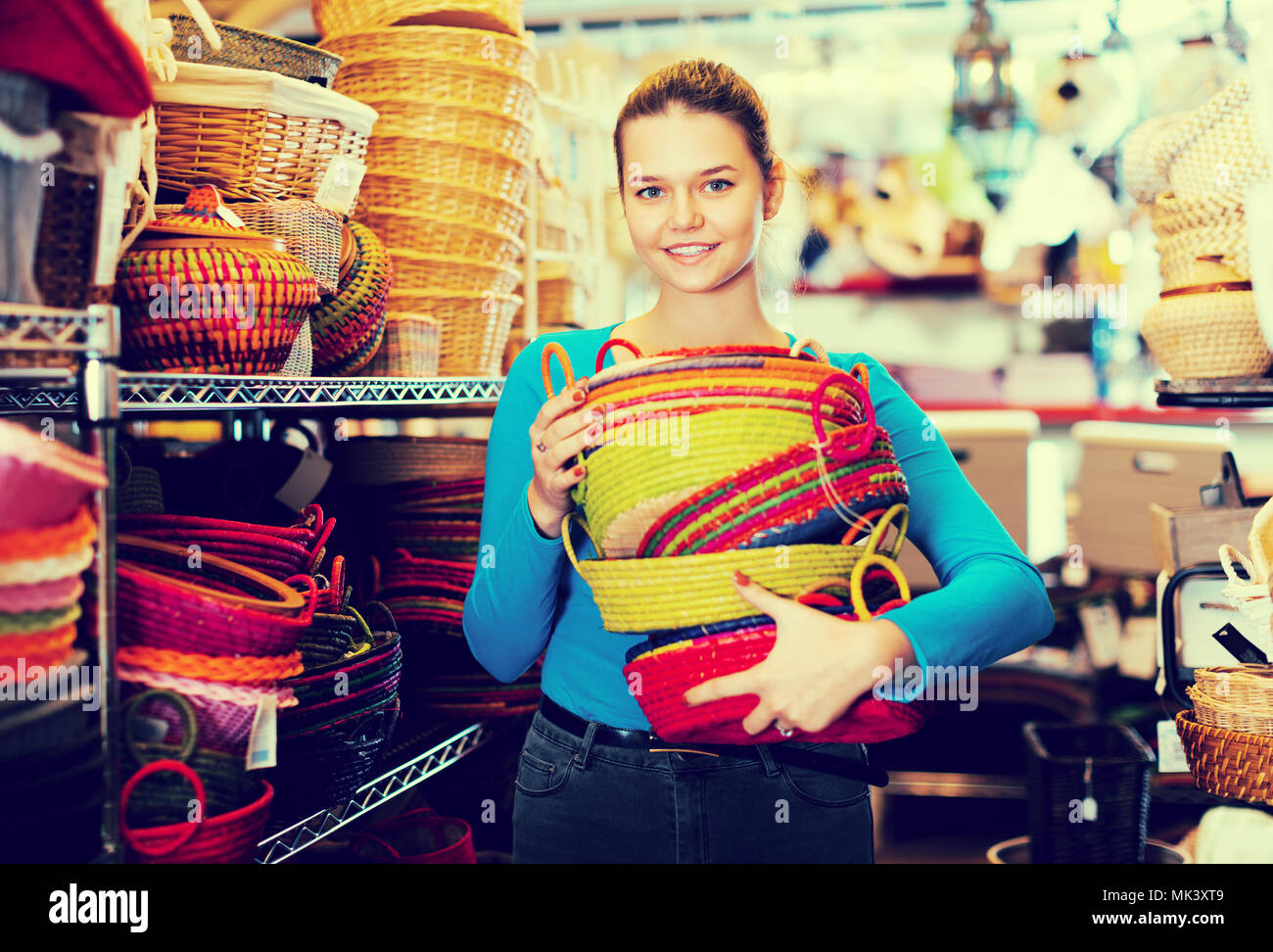 happy female choosing colour wicker basket in decoration and store