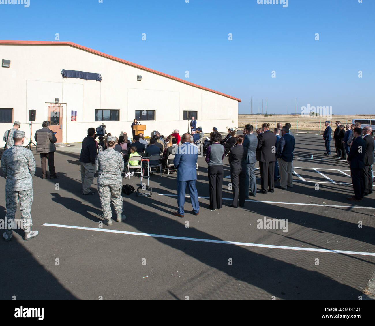 The Office of Special Investigation, 12th Field Investigation Squadron, unveil the renaming of their building to fallen OSI agent David Wieger during a ceremony at Travis Air Force Base, Calif., Nov. 1, 2017. Wieger was killed in 2007 when an improvised explosive device struck his vehicle during his deployment in support of Operation Iraqi Freedom. Wieger was stationed at Travis at the time and was posthumously awarded the Bronze Star, Purple Heart, AF Commendation Medal, and AF Combat Action Medal. (U.S. Air Force photo by Louis Briscese) Stock Photo