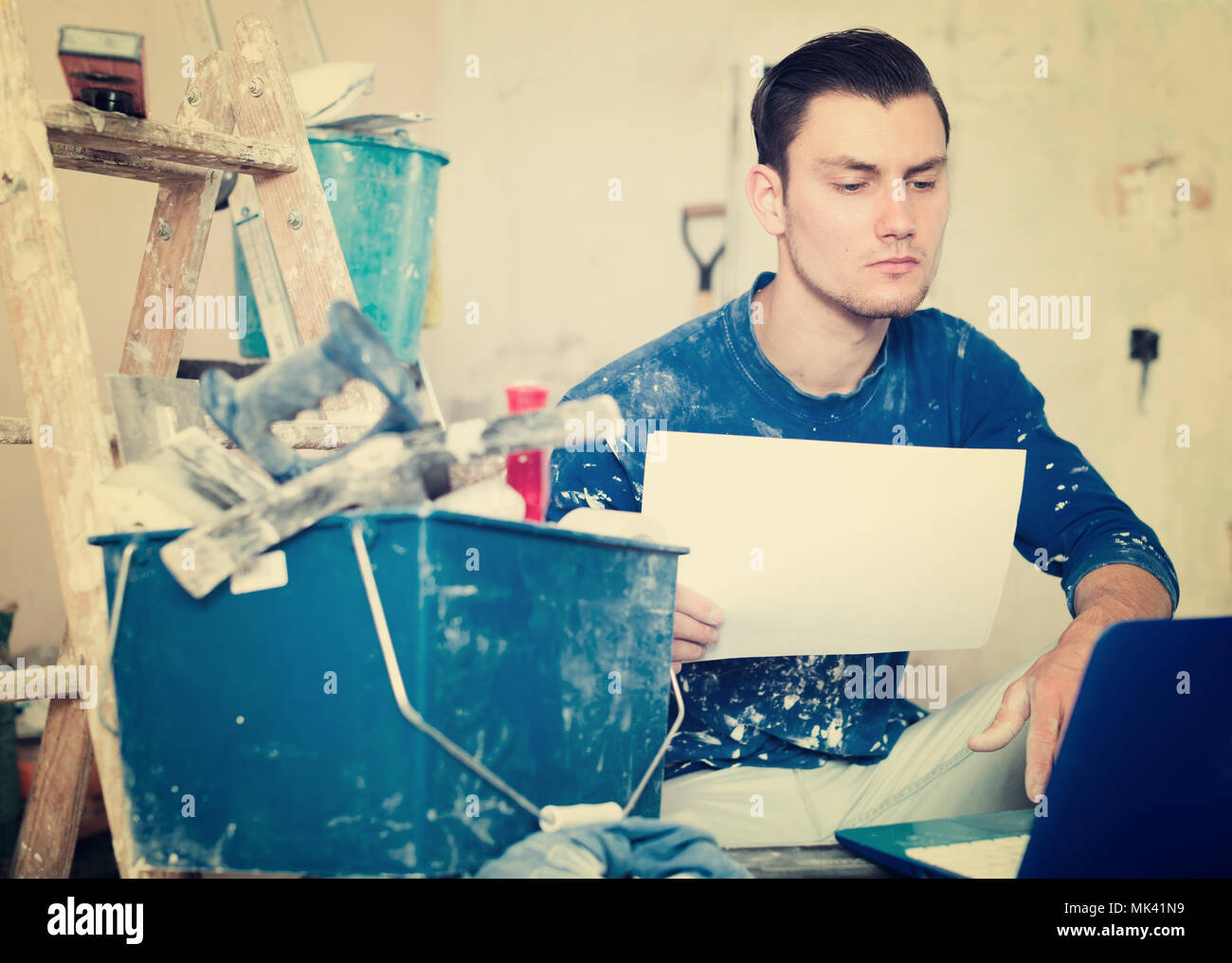 Male worker working laptop blueprints hi-res stock photography and ...