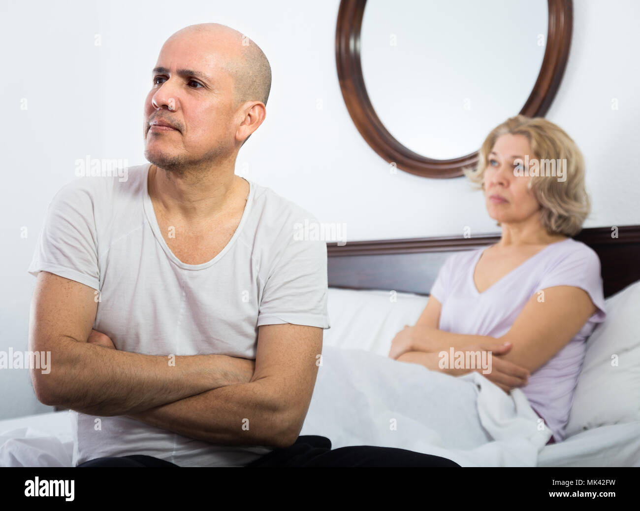 Mature wife com Frustrated Mature Wife And Husband Having Conflict In Bedroom Stock Photo Alamy