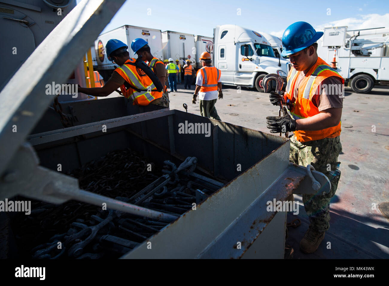 U.S. Navy Sailors assigned to the Navy Cargo Handling Battalion One