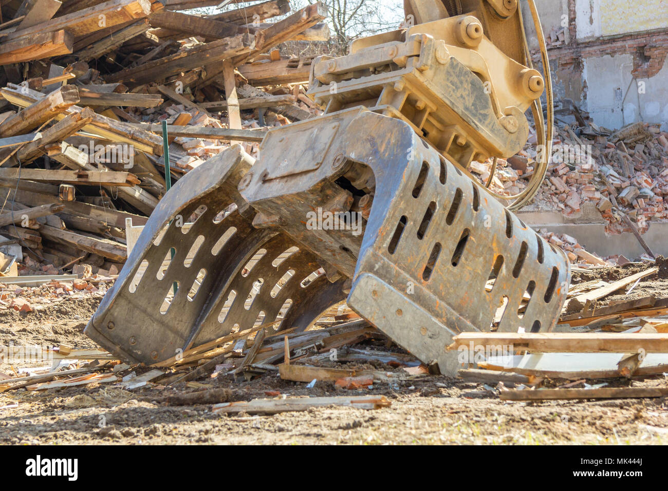 Digger bucket lies on a construction site Stock Photo