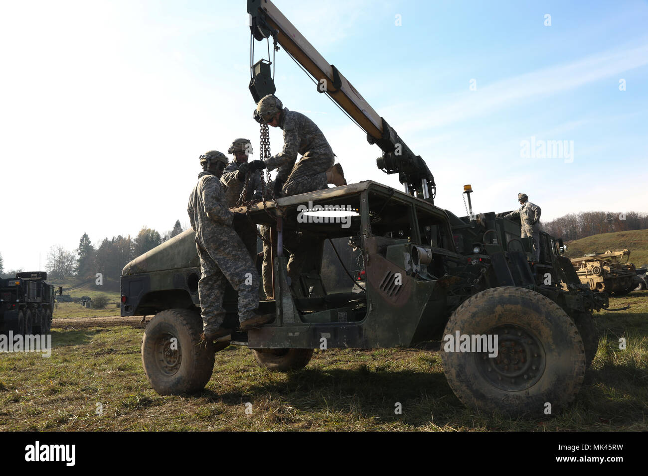 U.S. Soldiers of the 902nd Engineer Construction Company perform vehicle recovery operations in preparation of exercise Allied Spirit VII at the U.S. Army’s Joint Multinational Readiness Center in Hohenfels, Germany, Nov. 5, 2017. Approximately 4,050 service members from 13 nations are participating in exercise Allied Spirit VII at 7th Army Training Command’s Hohenfels Training Area, Germany, Oct. 30 to Nov. 22, 2017. Allied Spirit is a U.S. Army Europe-directed, 7ATC-conducted multinational exercise series designed to develop and enhance NATO and key partner’s interoperability and readiness.  Stock Photo