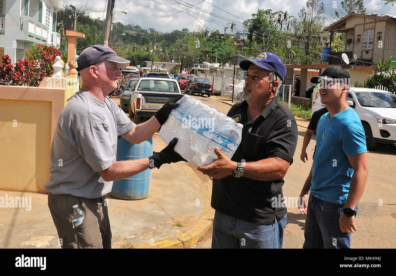 Citizens-Soldiers of the Puerto Rico Army National 92nd MP Brigade, continue with their effort of distributing supplies, food and water to affected communities around the island of Puerto Rico along with other agencies and voluntary personnel collaborating with the humanitarian effort in the aftermath of Hurricane Maria, Nov 2.  State-side volunteers joined the relief efforts impacting the ‘Los Guardias’ sector in the community of ‘Palmarito’ in Corozal, Puerto Rico. This community was flooded as a consequence of the hurricane impact leaving this community with massive losses and needs.  (Nati Stock Photo