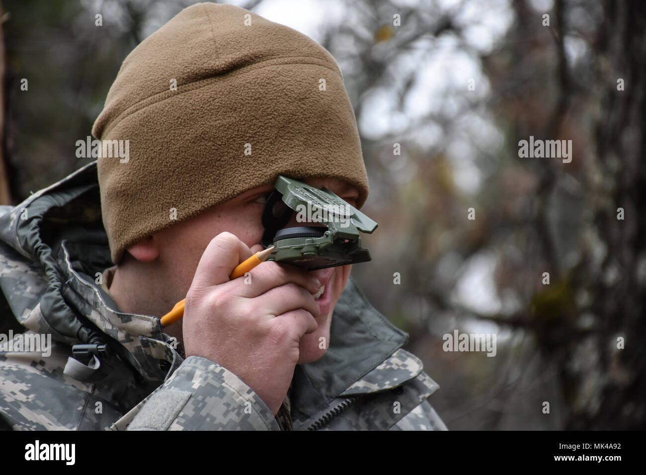 Specialist Christian Patton, 304th Civil Affairs Brigade, finds his next point on the Land Navigation Course during the 353rd Civil Affairs Command Best Warrior Competition at Fort McCoy, Wisconsin, November 3, 2017.  (U.S. Army Reserve photo by Catherine Lowrey, 88th Regional Support Command Public Affairs Office) Stock Photo