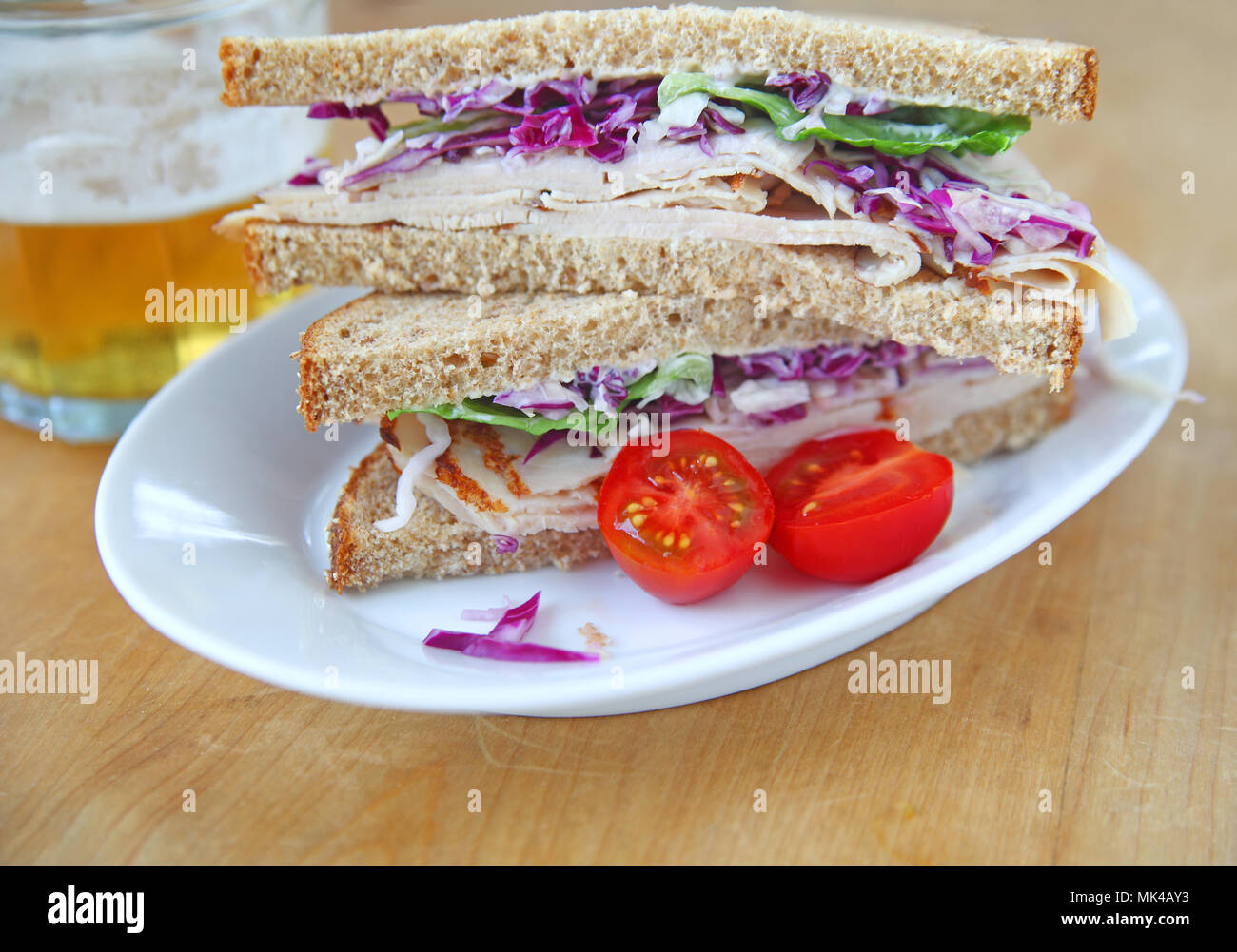 Turkey sandwich on whole wheat bread cut in half Stock Photo Alamy